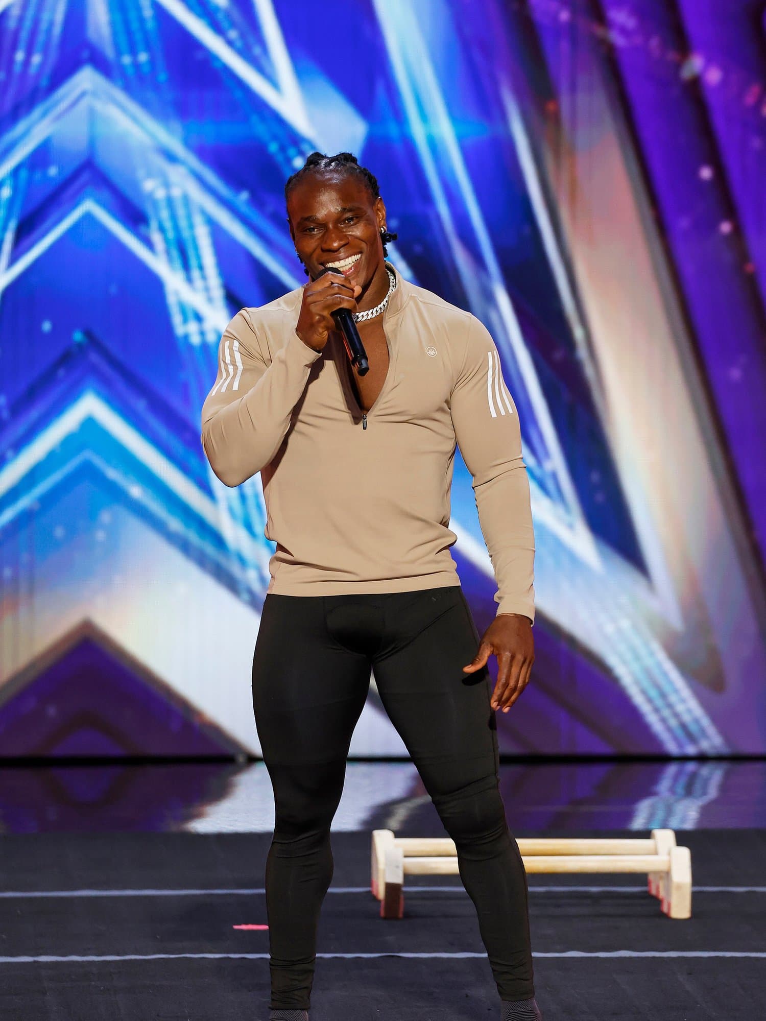 Beast Nation athlete performing under the lights on the America's Got Talent stage