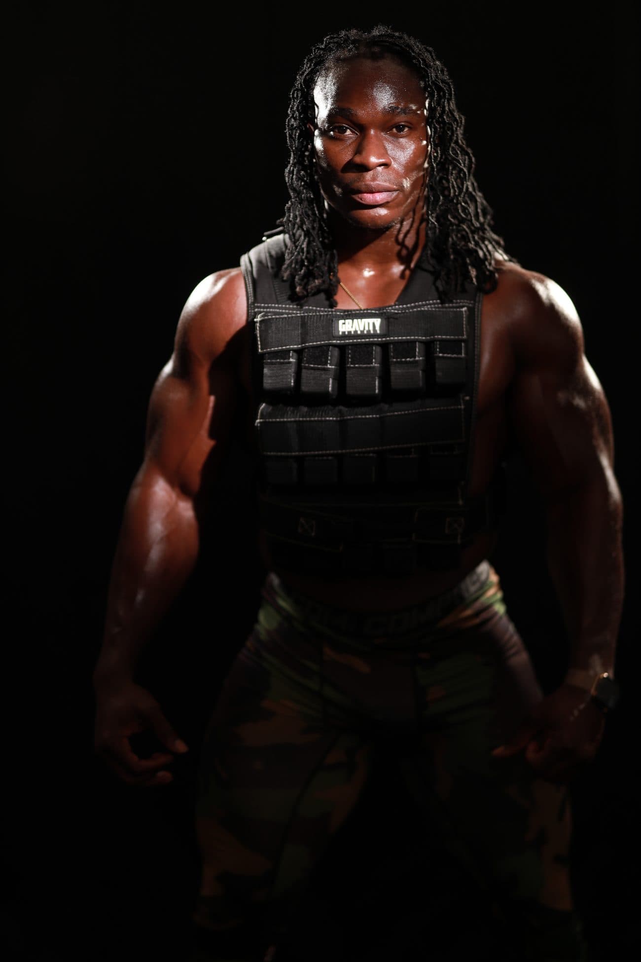 Alseny Sylla standing in a weighted conditioning vest